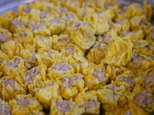 Close up on a bunch of cooked pork streamed dumplings - Thai Kanom Jeeb photo