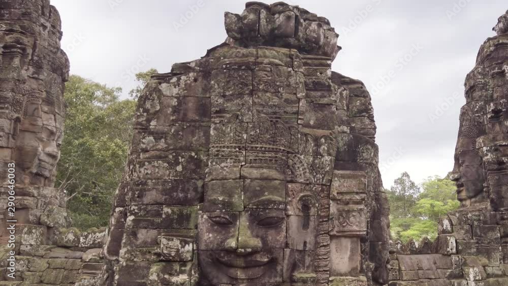 Details, Bayon faces temple inside Angkor Thom complex. Daytime on a cloudy day. Details, Bayon faces temple inside Angkor Thom complex. Daytime on a cloudy day.