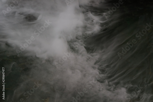 Swirl fog is flowing over a water surface