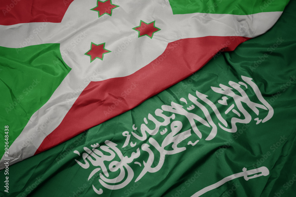 waving colorful flag of saudi arabia and national flag of burundi . waving colorful flag of saudi arabia and national flag of burundi .