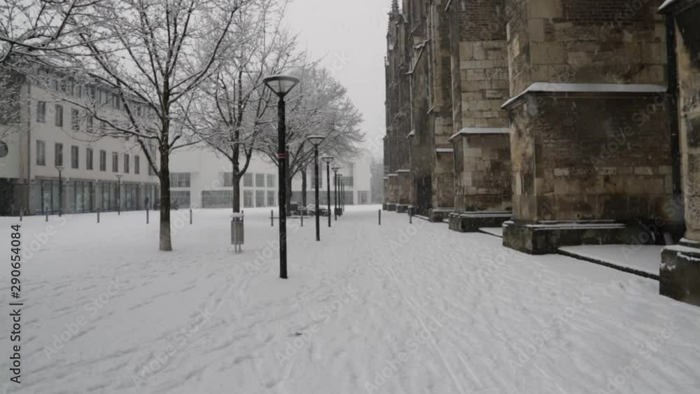 Super wide shot of a snow covered alley in Ulm. Huge minster on the right side of the frame. Super wide shot of a snow covered alley in Ulm. Huge minster on the right side of the frame.