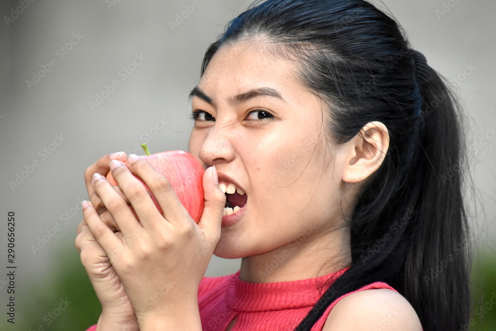 Youthful Minority Female Eating With Apples Youthful Minority Female Eating With Apples
