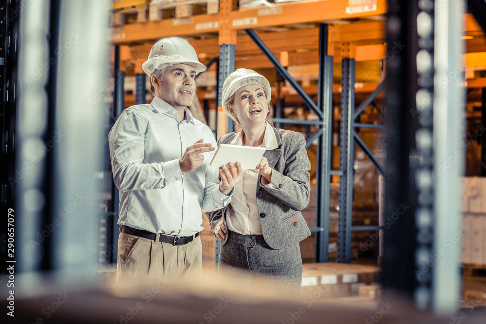 Joyful colleagues working together at their factory Joyful colleagues working together at their factory