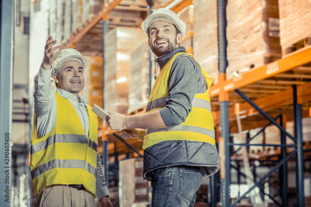 Positive delighted workers looking in one direction