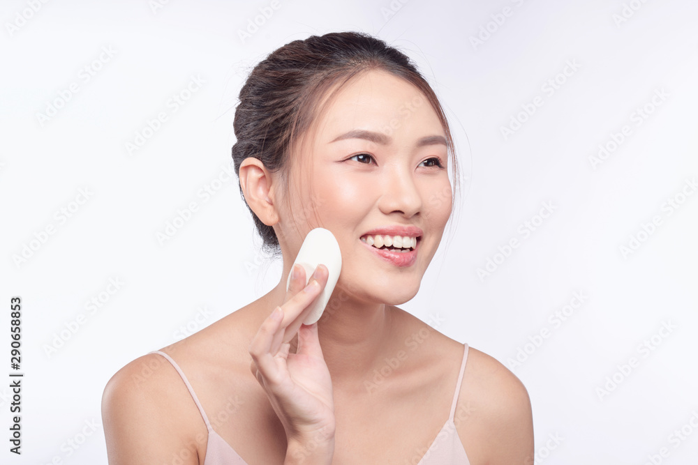 natural beautiful woman with powder puff on white background natural beautiful woman with powder puff on white background