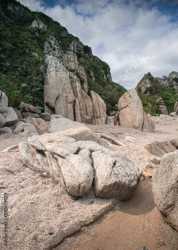 Sandy beach with large boulders