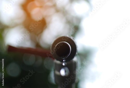 Close up faucet and drop of water ,shortage and drought concept. selective and soft focus. © Warunya