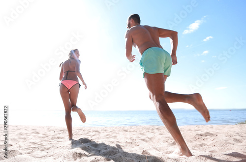 Happy Couple Running on Tropical Beach at Sunset, Vacation
