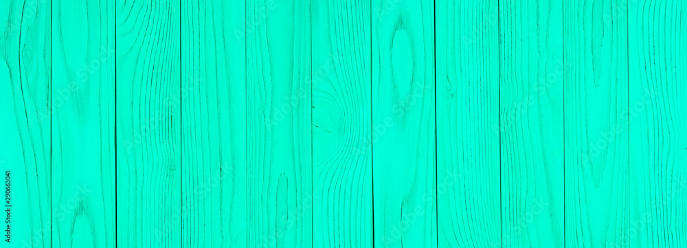 Obraz premium The texture of green from old wooden planks arranged in a vertical order.