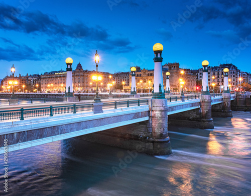 View on Zurriola bridge over Urumea river at night in San Sebastian