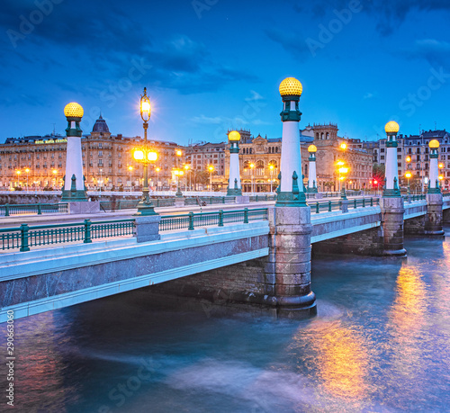 View on Zurriola bridge over Urumea river at night in San Sebastian photo