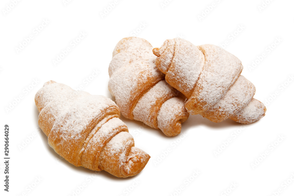 Group of croissants sprinkled with powdered sugar Group of croissants sprinkled with powdered sugar