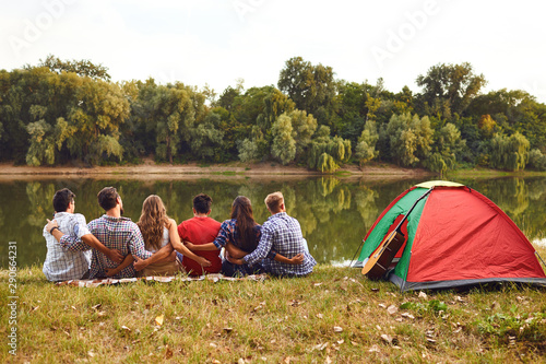 Group of people smiling standing on a picnic
