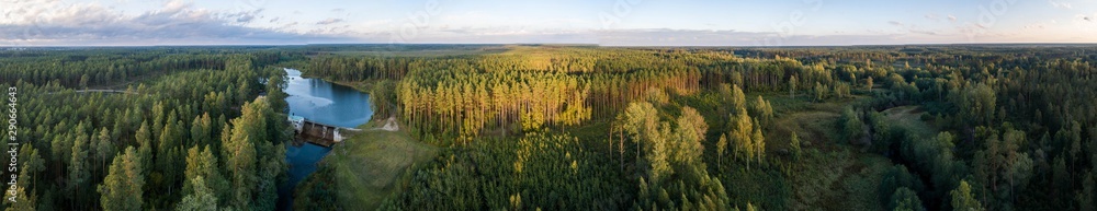 Aerial view of river among the forest. Summer nature landscape. Sunset. Aerial view of river among the forest. Summer nature landscape. Sunset.