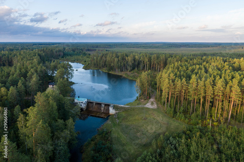 Aerial view of river among the forest. Summer nature landscape. Sunset. © nikwaller