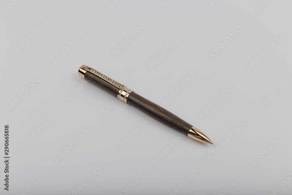 Exotic, Luxury Iroko wood bolt-action pen with chrome metal fixtures and beautiful knot in the wood - Product Photo Ballpoint Pen Handmade Hand Crafted. Exotic, Luxury Iroko wood bolt-action pen with chrome metal fixtures and beautiful knot in the wood - Product Photo Ballpoint Pen Handmade Hand Crafted.