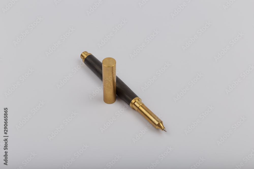 Exotic, Luxury Iroko wood bolt-action pen with chrome metal fixtures and beautiful knot in the wood - Product Photo Ballpoint Pen Handmade Hand Crafted. Exotic, Luxury Iroko wood bolt-action pen with chrome metal fixtures and beautiful knot in the wood - Product Photo Ballpoint Pen Handmade Hand Crafted.