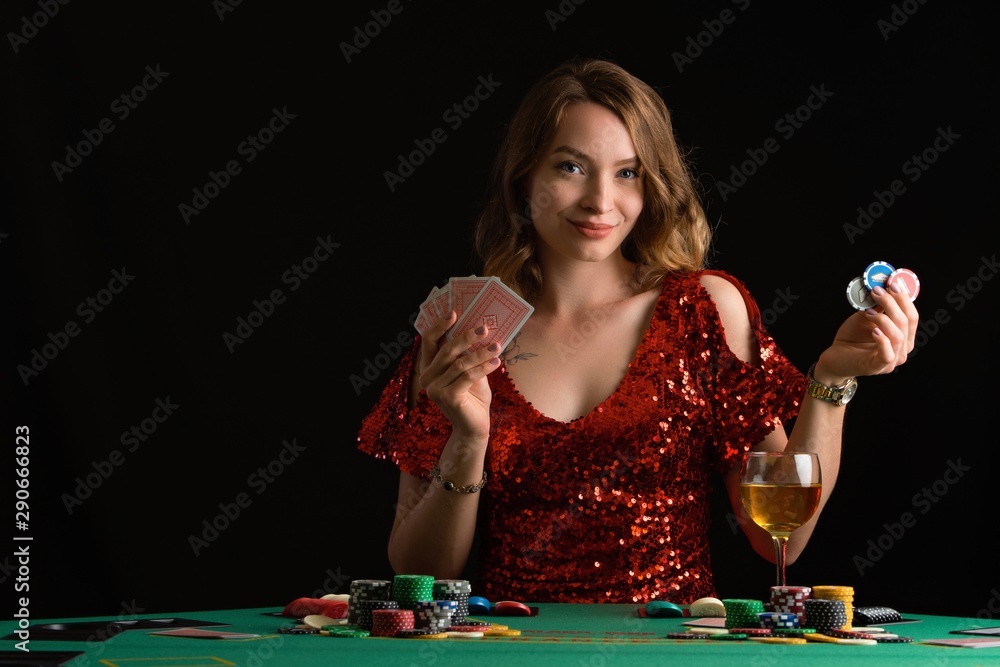 A woman plays in a casino. Woman puts a lot of chips. Gaming business and entertainment. A woman plays in a casino. Woman puts a lot of chips. Gaming business and entertainment.
