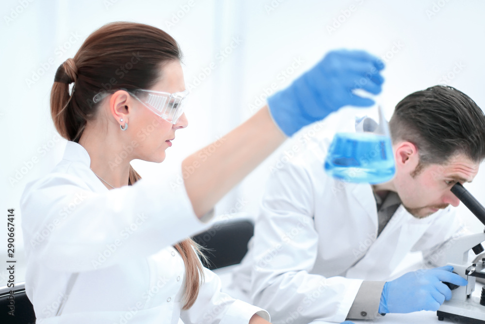 Two scientists are working in laboratory. Two scientists are working in laboratory.
