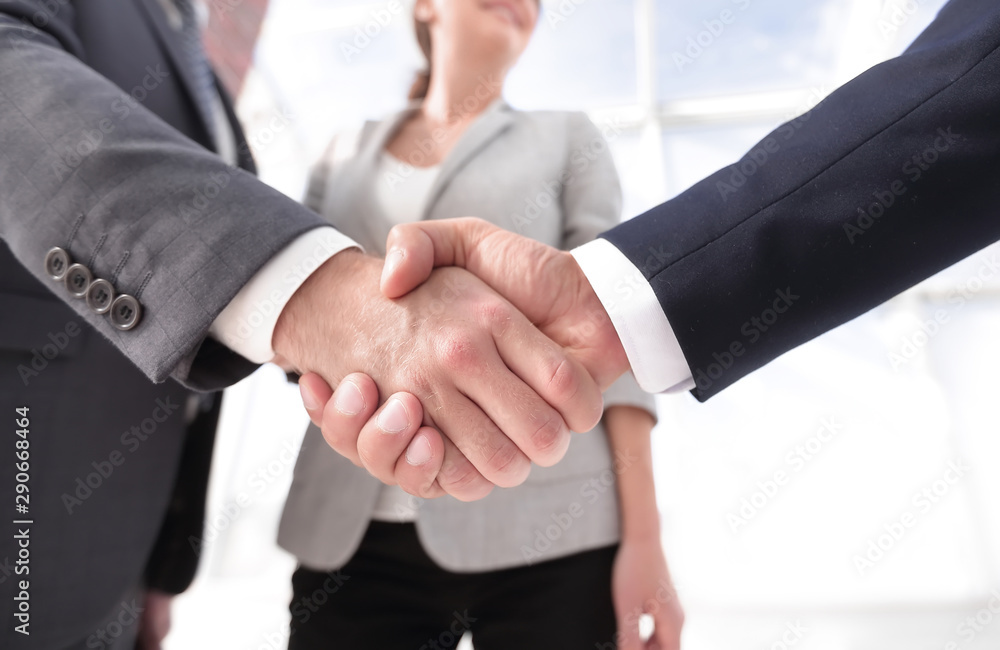 friendly handshake of business people. friendly handshake of business people.