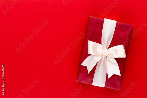 Christmas gift boxes with ribbons on color tabletop. © gitusik
