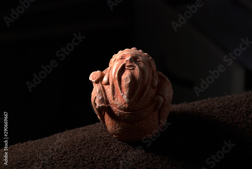  ivory netsuke on a dark background photo