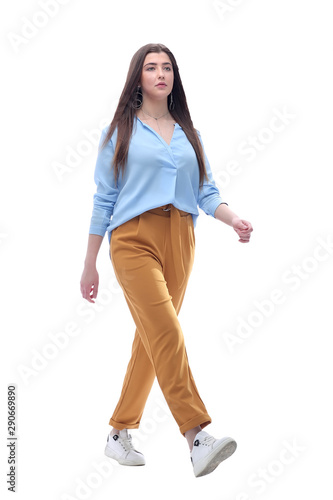 young woman confidently stepping forward. isolated on white