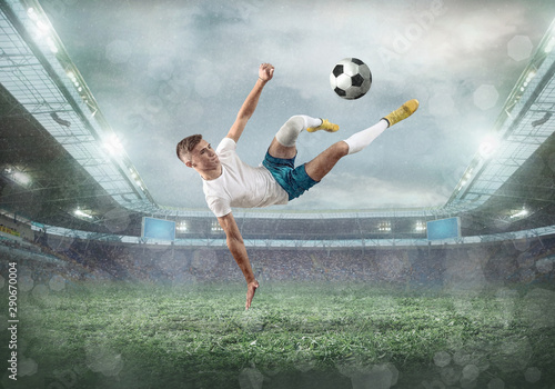 Soccer player on a football field in dynamic action at summer da