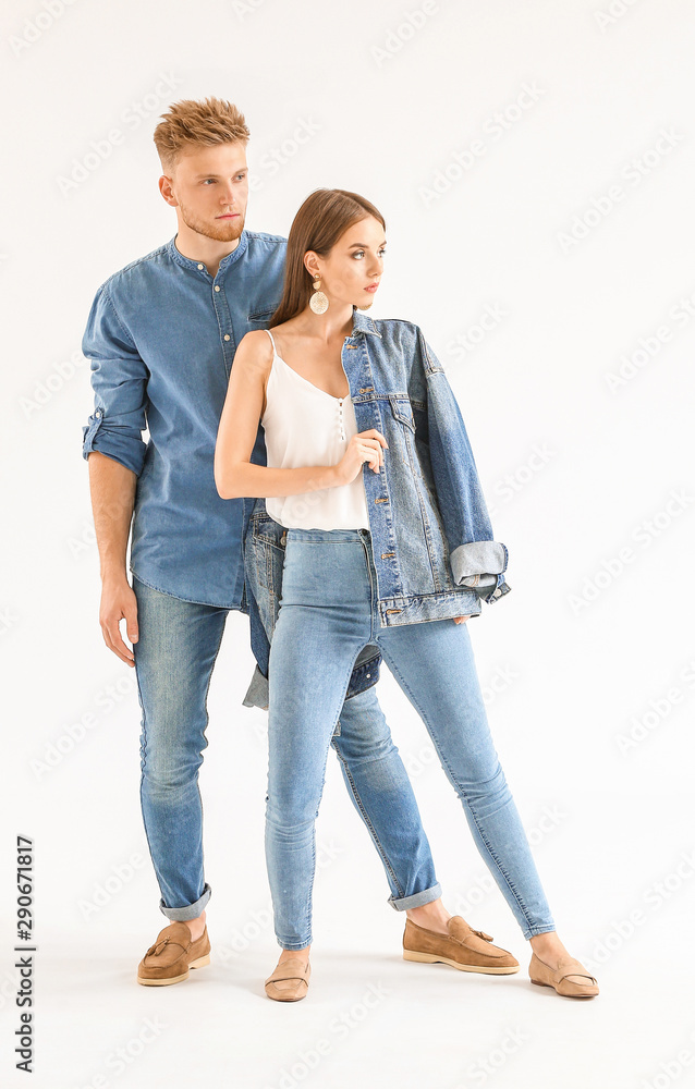 Fashionable young couple in stylish casual clothes on white background Fashionable young couple in stylish casual clothes on white background