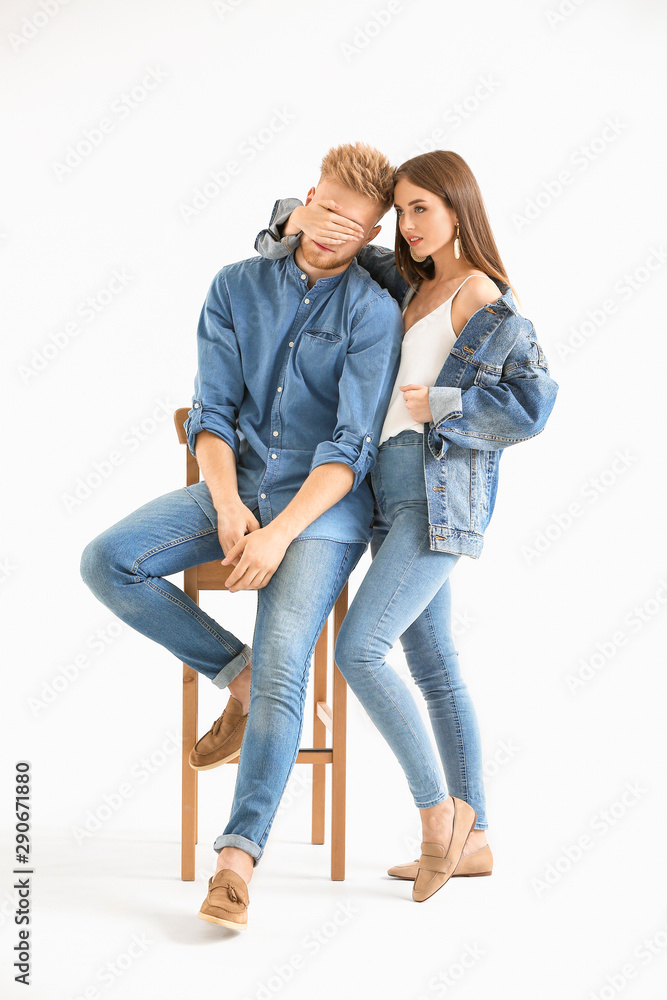 Fashionable young couple in stylish casual clothes on white background Fashionable young couple in stylish casual clothes on white background