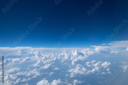 Blue sky with clouds Top view from the airplane window, Natural cloudscape for copy space.