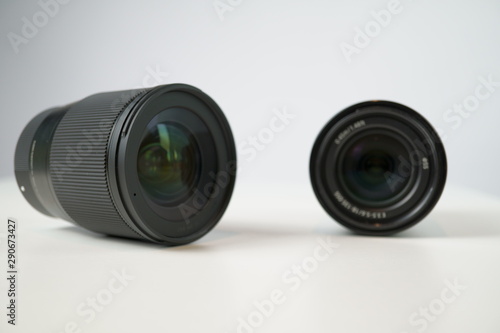 dslr camera lense, close-up view on table with smooth background