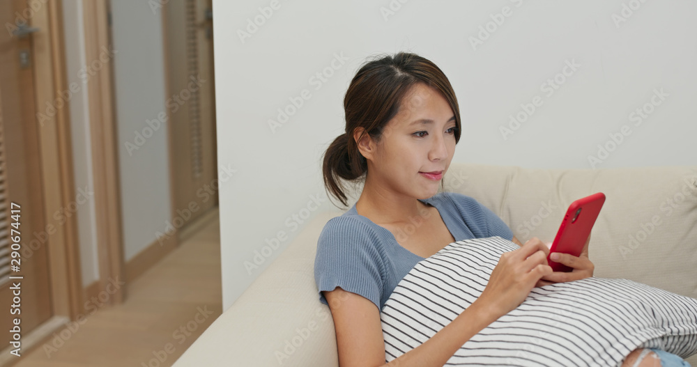Woman use of mobile phone online