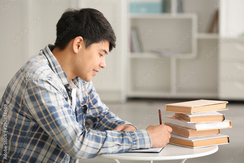 Asian student preparing for exam at home Asian student preparing for exam at home