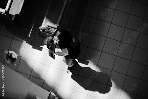 African american woman praying in the church. Believers meditates in the cathedral and spiritual time of prayer. View from above.