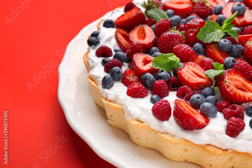 Tasty berry pie on color background  closeup