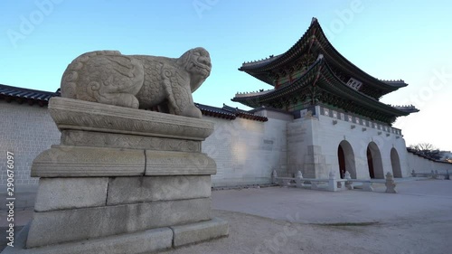 Camera tilt down on Main gate of 
Gwanghwamun Palace at early morning sun rise when its no people around photo