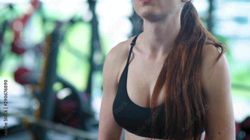 Athletic woman in Gym lifts the weight, muscle training with weights, crossfit. Athletic woman in Gym lifts the weight, muscle training with weights, crossfit.