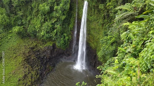 Fuipisia Waterfall in Samoa amongst the lush green landscape photo