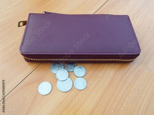 wallet, banknotes and coins on the table