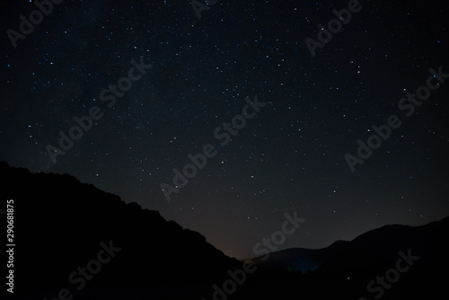 Milky Way over the head. Night starry sky over the mountains. Stars and constellations in the sky.