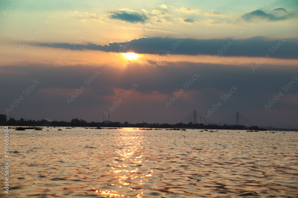 Cinematic scenery of sunset over the Mekong River in the Mekong Delta