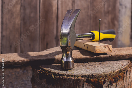 Hammer and nails on wooden plates concepts is Carpenter's tools