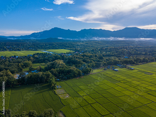 Village Small among mountains, greenforests, rice fields, rivers photo