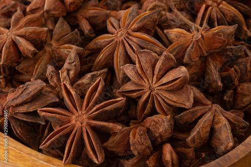 Star anise isolated on wooden background.