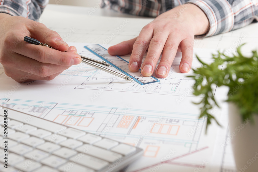 Architects working on blueprint. Architects workplace. Construction concept. Engineering tools. Architects working on blueprint. Architects workplace. Construction concept. Engineering tools.