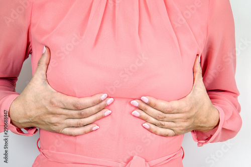 Wallpaper Mural Breast size and health concept. Woman holding her bust Torontodigital.ca