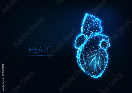 Futuristic glowing low polygonal human heart isolated on dark blue background.