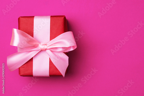 Gift box on a beautiful background with a satin ribbon. Holiday concept © Jane_S