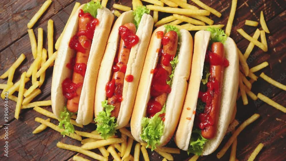 American hot dogs assorted in row. Served with french fries American hot dogs assorted in row. Served with french fries